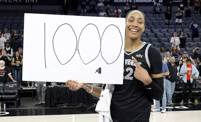 Las Vegas Aces center A'ja Wilson (22) poses after an WNBA basketball game against the Connecticut Sun, Sunday, Sept. 15, 2024, in Las Vegas.(Steve Marcus/Las Vegas Sun via AP)