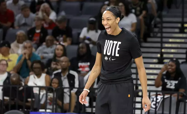 Las Vegas Aces center A'ja Wilson laughs during warmups before a WNBA basketball game against the Las Vegas Aces, Sunday, Sept. 15, 2024, in Las Vegas. (Steve Marcus/Las Vegas Sun via AP)