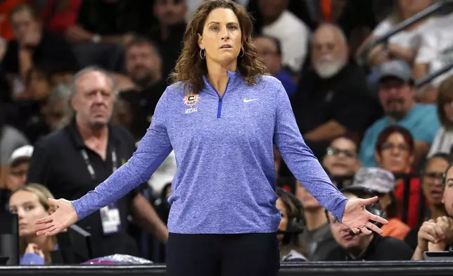 Connecticut Sun head coach Stephanie White reacts during the first half of a WNBA basketball game against the Las Vegas Aces, Sunday, Sept. 15, 2024, in Las Vegas. (Steve Marcus/Las Vegas Sun via AP)