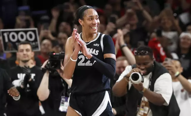 Las Vegas Aces center A'ja Wilson (22) celebrates during the second half of a WNBA basketball game against the Connecticut Sun, Sunday, Sept. 15, 2024, in Las Vegas. (Steve Marcus/Las Vegas Sun via AP)