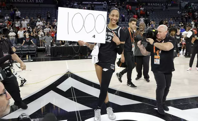 Las Vegas Aces center A'ja Wilson (22) poses after an WNBA basketball game against the Connecticut Sun, Sunday, Sept. 15, 2024, in Las Vegas.(Steve Marcus/Las Vegas Sun via AP)