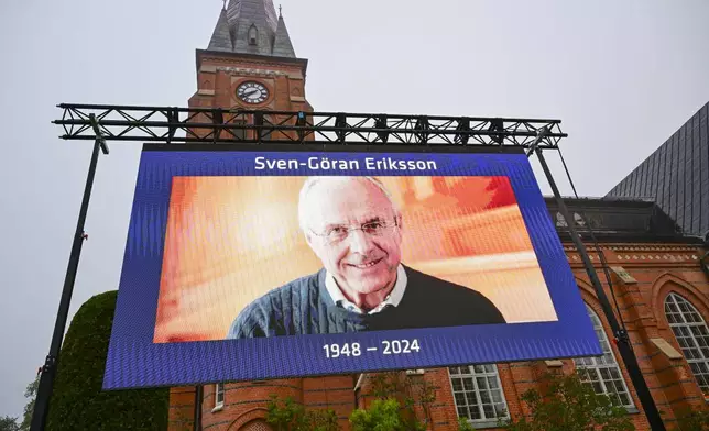 A general view of a screen outside Fryksande Church in Torsby, Sweden, ahead of the funeral for football legend Sven-Goran Eriksson, Friday, Sept. 13, 2024. (Jonas EkströmerTT News Agency via AP)