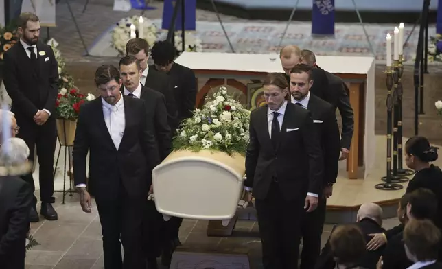 The coffin of Swedish soccer manager Sven-Goran Eriksson is carried out of the Fryksände church after the funeral service in Torsby, Sweden, Friday Sept. 13, 2024. (Adam Ihse/TT News Agency via AP)