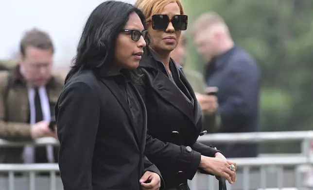 Yaniseth Alcides, right, the partner of Swedish soccer manager Sven-Goran Eriksson arrives at his funeral service at Fryksände church in Torsby, Sweden, Friday Sept. 13, 2024. (Jonas Ekströmer/TT News Agency via AP)