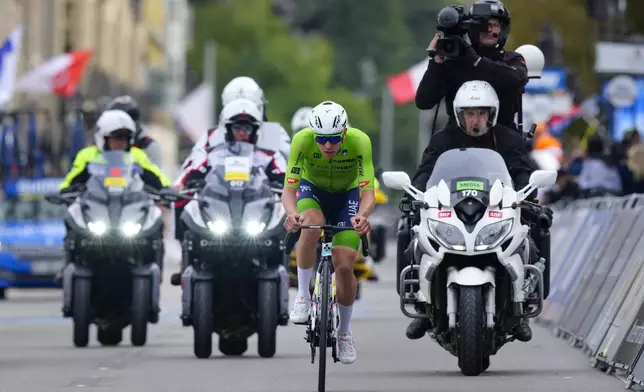 Slovenia's Tadej Pogacar attacks during the Men Elite road race of the Cycling and Para-cycling Road World Championships in Zurich, Switzerland, Sunday, Sept. 29, 2024. (AP Photo/Peter Dejong)