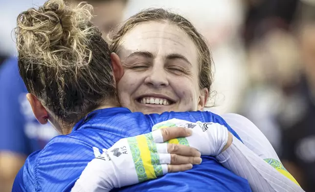 Grace Brown of Australia smiles after winning the women elite individual time trial over 29.9 kilometers (18.6 miles) at the Cycling World Championships in Zurich, Switzerland, Sunday, Sept. 22, 2024. (Michael Buholzer/Keystone via AP)