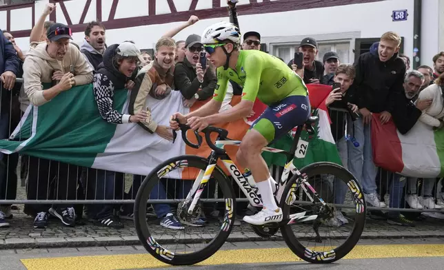 Slovenia's Tadej Pogacar attacks during the Men Elite road race of the Cycling and Para-cycling Road World Championships in Zurich, Switzerland, Sunday, Sept. 29, 2024. (AP Photo/Peter Dejong)