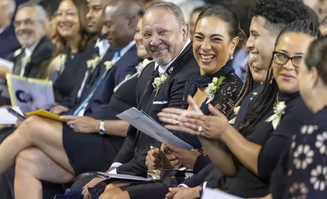 The children and grandchildren of Sybil Haydel Morial laugh as fun memories are shared by speakers during a Celebration of Life for Morial at Xavier University of Louisiana, Monday, Sept. 23, 2024, in New Orleans. (Chris Granger/The Times-Picayune/The New Orleans Advocate via AP)