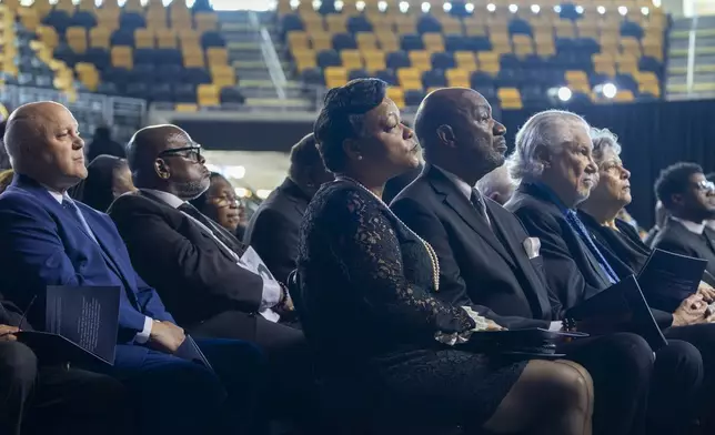 New Orleans Mayor Latoya Cantrell, center, sits next to former New Orleans mayors, Mitch Landrieu, far left, and Sidney Barthelemy, far right in blue shirt, at the Celebration of Life for Sybil Haydel Morial at Xavier University of Louisiana, Monday, Sept. 23, 2024, in New Orleans. (Chris Granger/The Times-Picayune/The New Orleans Advocate via AP)