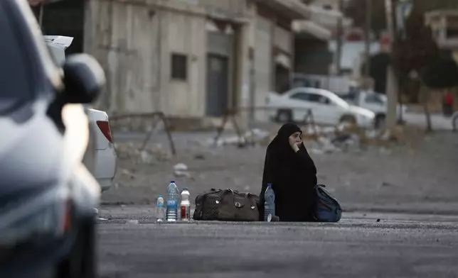 A Lebanese fleeing the Israeli bombardment, arrives at the Syrian-Lebanese border crossing in Jdaidet Yabous, Syria, Tuesday, Sept. 24, 2024. (AP Photo/Omar Sanadiki)