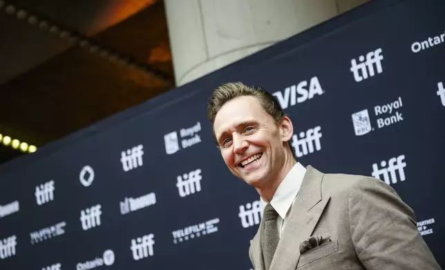 Tom Hiddleston arrives on the red carpet ahead of the premiere of the film "The Life of Chuck", during the Toronto International Film Festival, in Toronto on Friday, September 6, 2024. THE CANADIAN PRESS/Christopher Katsarov/The Canadian Press via AP)