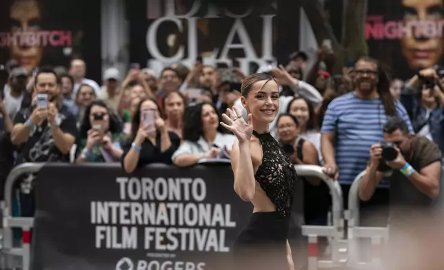 Kiernan Shipka poses for photos with fans at the premiere of "The Last Showgirl" at the Princess of Wales Theatre, during the Toronto International Film Festival, in Toronto, Friday Sept. 6, 2024. (Paige Taylor White/The Canadian Press via AP)