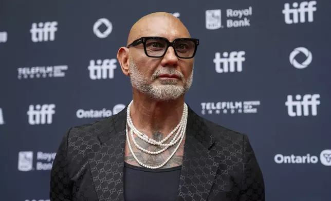 Dave Bautista stands on the red carpet for the premiere of "The Last Showgirl" at the Princess of Wales Theatre, during the Toronto International Film Festival, in Toronto, Friday Sept. 6, 2024. (Paige Taylor White/The Canadian Press via AP)