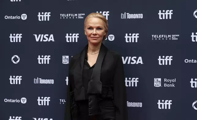 Pamela Anderson stands on the red carpet for the premiere of "The Last Showgirl" at the Princess of Wales Theatre, during the Toronto International Film Festival, in Toronto, Friday Sept. 6, 2024. (Paige Taylor White/The Canadian Press via AP)