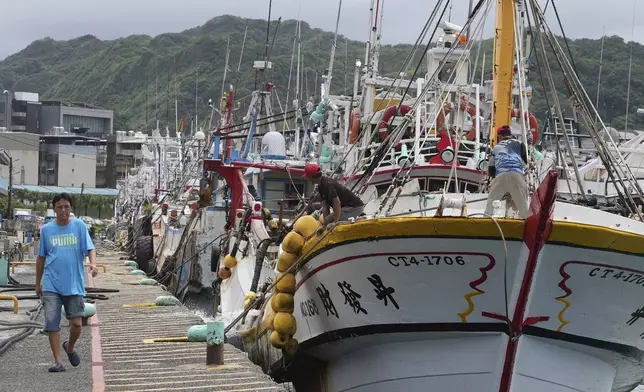 Boats are seen tightened with ropes before Typhoon Krathon arrives, at a harbor in Keelung, Taiwan, Monday, Sept. 30, 2024. (AP Photo/Johnson Lai)