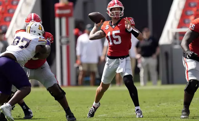 Georgia quarterback Carson Beck (15) throws a pass during the first half of an NCAA college football game against Tennessee Tech Saturday, Sept. 7, 2024, in Athens, Ga. (AP Photo/John Bazemore)