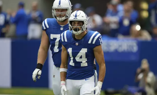 Indianapolis Colts wide receiver Alec Pierce (14) celebrates a touchdown during the first half of an NFL football game against the Houston Texans, Sunday, Sept. 8, 2024, in Indianapolis. (AP Photo/Darron Cummings)