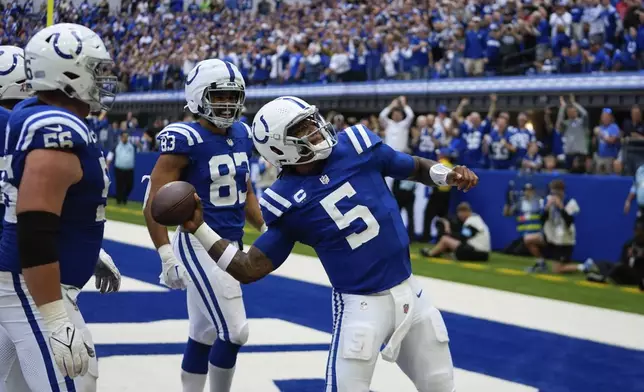 Indianapolis Colts quarterback Anthony Richardson (5) celebrates a touchdown during the second half of an NFL football game against the Houston Texans, Sunday, Sept. 8, 2024, in Indianapolis. (AP Photo/Darron Cummings)