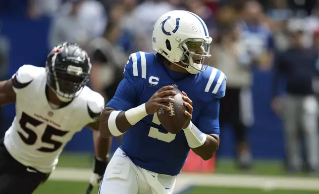 Indianapolis Colts quarterback Anthony Richardson (5) looks for a receiver during the first half of an NFL football game against the Houston Texans, Sunday, Sept. 8, 2024, in Indianapolis. (AP Photo/Darron Cummings)