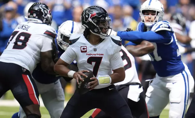 Houston Texans quarterback C.J. Stroud (7) looks for a receiver during the first half of an NFL football game against the Indianapolis Colts, Sunday, Sept. 8, 2024, in Indianapolis. (AP Photo/Michael Conroy)