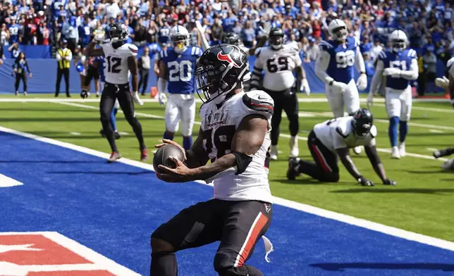 Houston Texans running back Joe Mixon (28) runs to the end zone for a touchdown during the second half of an NFL football game against the Indianapolis Colts, Sunday, Sept. 8, 2024, in Indianapolis. (AP Photo/Darron Cummings)