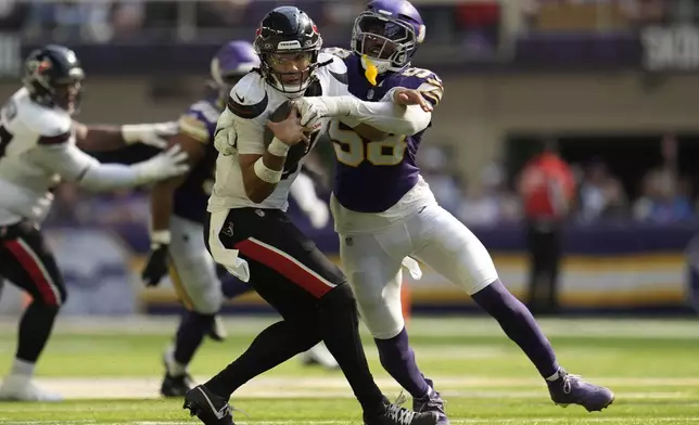 Houston Texans quarterback C.J. Stroud (7) is sacked by Minnesota Vikings linebacker Jonathan Greenard (58) during the second half of an NFL football game, Sunday, Sept. 22, 2024, in Minneapolis. (AP Photo/Abbie Parr)