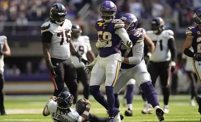 Minnesota Vikings linebacker Jonathan Greenard (58) celebrates after sacking Houston Texans quarterback C.J. Stroud (7) during the second half of an NFL football game, Sunday, Sept. 22, 2024, in Minneapolis. (AP Photo/Abbie Parr)