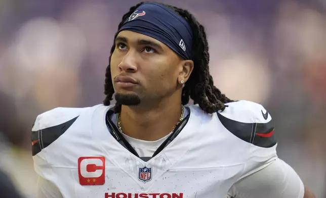 Houston Texans quarterback C.J. Stroud (7) walks off the field after an NFL football game against the Minnesota Vikings, Sunday, Sept. 22, 2024, in Minneapolis. The Vikings won 34-7. (AP Photo/Abbie Parr)