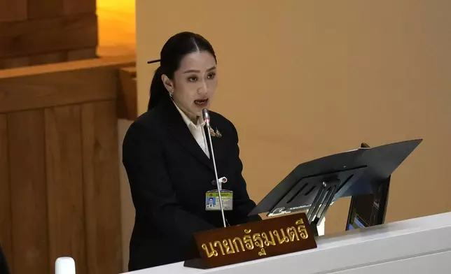 Thailand's Prime Minister Paetongtarn Shinawatra reads the policy statement at parliament in Bangkok, Thailand, Thursday, Sept. 12, 2024. Paetongtarn appeared Parliament for the first time to lay out how her government envisions to improve the country. (AP Photo/Sakchai Lalit)