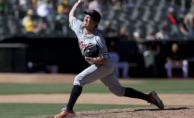 Detroit Tigers pitcher Kenta Maeda (18) throws against the Oakland Athletics during the ninth inning of a baseball game in Oakland, Calif., Sunday, Sept. 8, 2024. (AP Photo/Jed Jacobsohn)