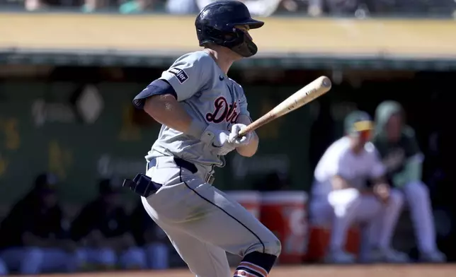 Detroit Tigers' Trey Sweeney watches his single during the ninth inning of a baseball game against the Oakland Athletics in Oakland, Calif., Sunday, Sept. 8, 2024. (AP Photo/Jed Jacobsohn)