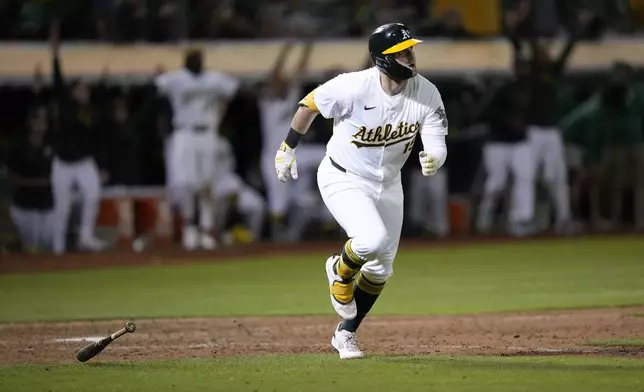 Oakland Athletics' Seth Brown hits a 2-run home run against the Detroit Tigers during the 11th inning of a baseball game Friday, Sept. 6, 2024, in Oakland, Calif. (AP Photo/Tony Avelar)