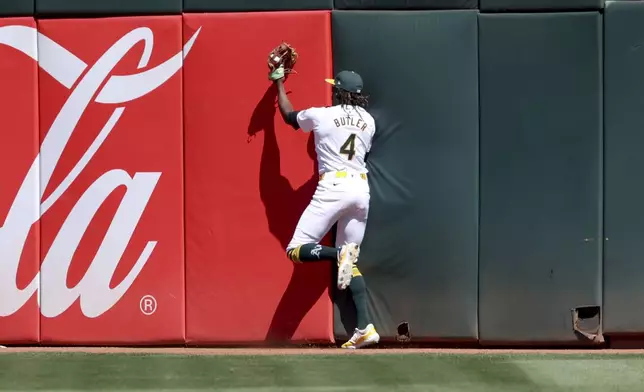 Oakland Athletics outfielder Lawrence Butler (4) catches a fly ball hit by Detroit Tigers' Spencer Torkelson during fifth inning of a baseball game in Oakland, Calif., Sunday, Sept. 8, 2024. (AP Photo/Jed Jacobsohn)