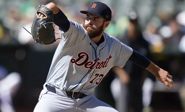 Detroit Tigers pitcher Sean Guenther (73) throws against the Oakland Athletics during the eighth inning of a baseball game Saturday, Sept. 7, 2024, in Oakland, Calif. (AP Photo/Tony Avelar)