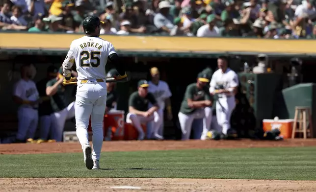 Oakland Athletics' Brent Rooker (25) walks back to the dugout after striking out during the fifth inning of a baseball game against the Detroit Tigers in Oakland, Calif., Sunday, Sept. 8, 2024. (AP Photo/Jed Jacobsohn)