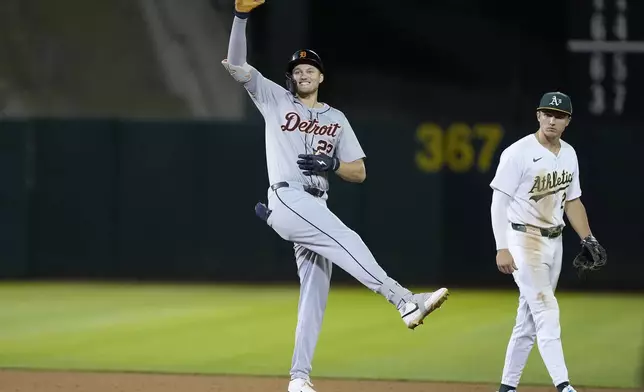 Detroit Tigers' Parker Meadows (22) reacts after hitting a 2 RBI double against the Oakland Athletics during the 11th inning of a baseball game Friday, Sept. 6, 2024, in Oakland, Calif. (AP Photo/Tony Avelar)