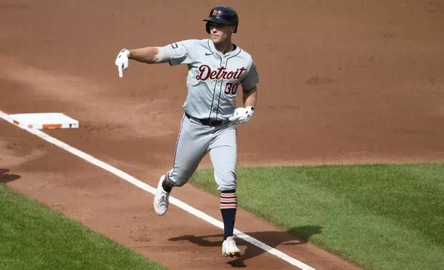 Detroit Tigers' Kerry Carpenter celebrates after his home run during the third inning of a baseball game against the Baltimore Orioles, Sunday, Sept. 22, 2024, in Baltimore. (AP Photo/Nick Wass)