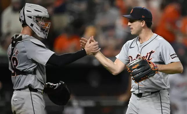 Detroit Tigers relief pitcher Beau Brieske, right, and catcher Dillon Dingler, celebrate after a baseball game against the Baltimore Orioles, Saturday, Sept. 21, 2024, in Baltimore. (AP Photo/Nick Wass)