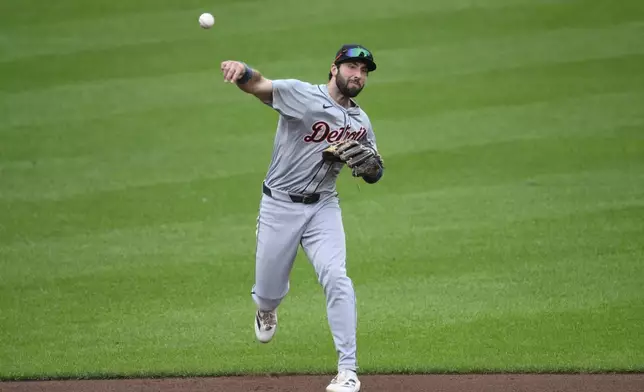 Detroit Tigers third baseman Matt Vierling throws to first base to put out Baltimore Orioles' Jackson Holliday during the fifth inning of a baseball game, Saturday, Sept. 21, 2024, in Baltimore. (AP Photo/Nick Wass)