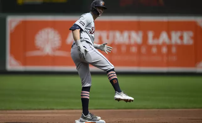 Detroit Tigers' Trey Sweeney gestures as he stands on second base with a double during the second inning of a baseball game against the Baltimore Orioles, Sunday, Sept. 22, 2024, in Baltimore. (AP Photo/Nick Wass)