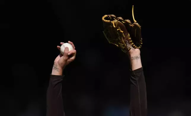 San Diego Padres starting pitcher Joe Musgrove stretches as he works against a Detroit Tigers batter during the second inning of a baseball game Monday, Sept. 2, 2024, in San Diego. (AP Photo/Gregory Bull)