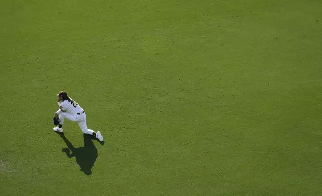 San Diego Padres right fielder Fernando Tatis Jr. looks on during a mound visit in the fifth inning of a baseball game against the Detroit Tigers, Monday, Sept. 2, 2024, in San Diego. (AP Photo/Gregory Bull)