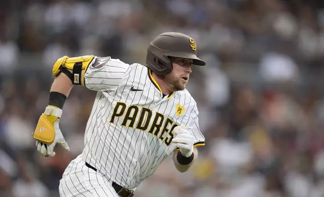 San Diego Padres' Jake Cronenworth watches his double during the second inning of a baseball game against the Detroit Tigers, Thursday, Sept. 5, 2024, in San Diego. (AP Photo/Gregory Bull)