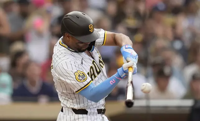 San Diego Padres' Xander Bogaerts hits a two-run home run during the second inning of a baseball game against the Detroit Tigers, Thursday, Sept. 5, 2024, in San Diego. (AP Photo/Gregory Bull)