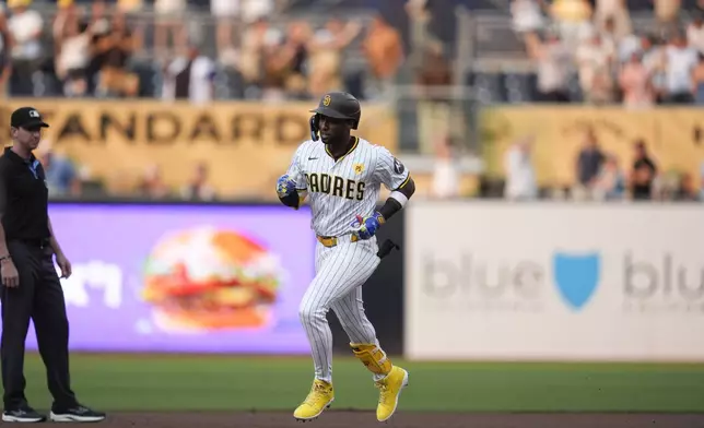 San Diego Padres' Jurickson Profar rounds the bases after hitting a home run during the first inning of a baseball game against the Detroit Tigers, Thursday, Sept. 5, 2024, in San Diego. (AP Photo/Gregory Bull)