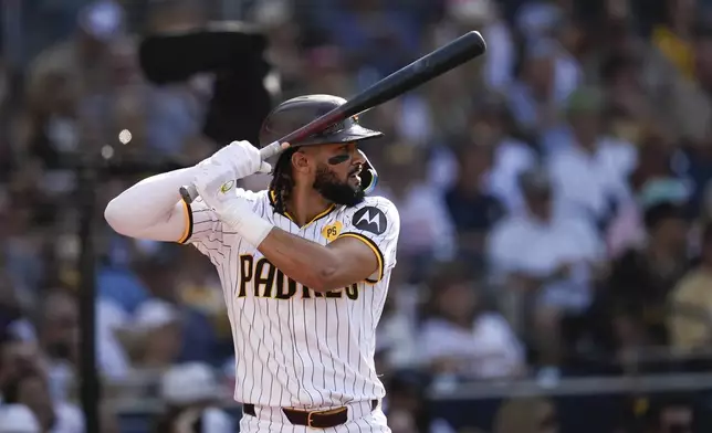 San Diego Padres' Fernando Tatis Jr. takes a practice swing before batting during the third inning of a baseball game against the Detroit Tigers Monday, Sept. 2, 2024, in San Diego. (AP Photo/Gregory Bull)