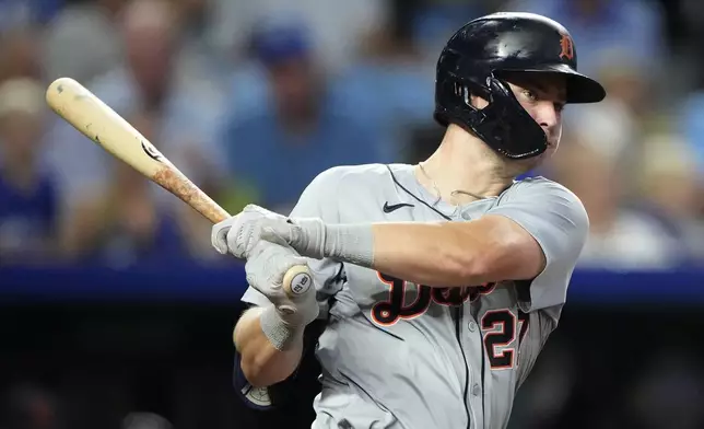 Detroit Tigers' Trey Sweeney watches his two-run double during the third inning of a baseball game against the Kansas City Royals Wednesday, Sept. 18, 2024, in Kansas City, Mo. (AP Photo/Charlie Riedel)