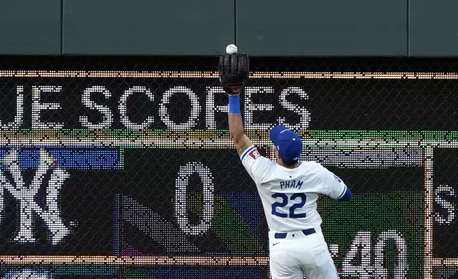 Kansas City Royals left fielder Tommy Pham fields an RBI double hit by Detroit Tigers' Matt Vierling during the first inning of a baseball game Tuesday, Sept. 17, 2024, in Kansas City, Mo. (AP Photo/Charlie Riedel)