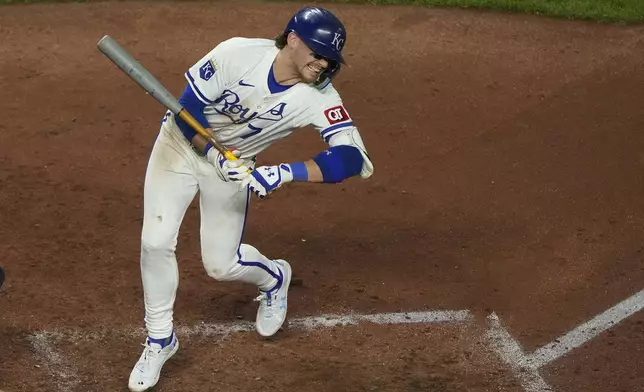 Kansas City Royals' Bobby Witt Jr. reacts after being hit by a pitch thrown by Detroit Tigers starting pitcher Tarik Skubal during the fifth inning of a baseball game Wednesday, Sept. 18, 2024, in Kansas City, Mo. (AP Photo/Charlie Riedel)