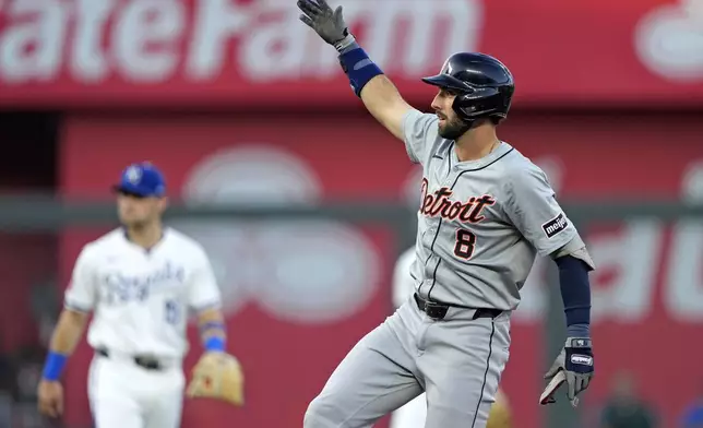 Detroit Tigers' Matt Vierling celebrates on second after hitting an RBI double during the first inning of a baseball game against the Kansas City Royals Tuesday, Sept. 17, 2024, in Kansas City, Mo. (AP Photo/Charlie Riedel)